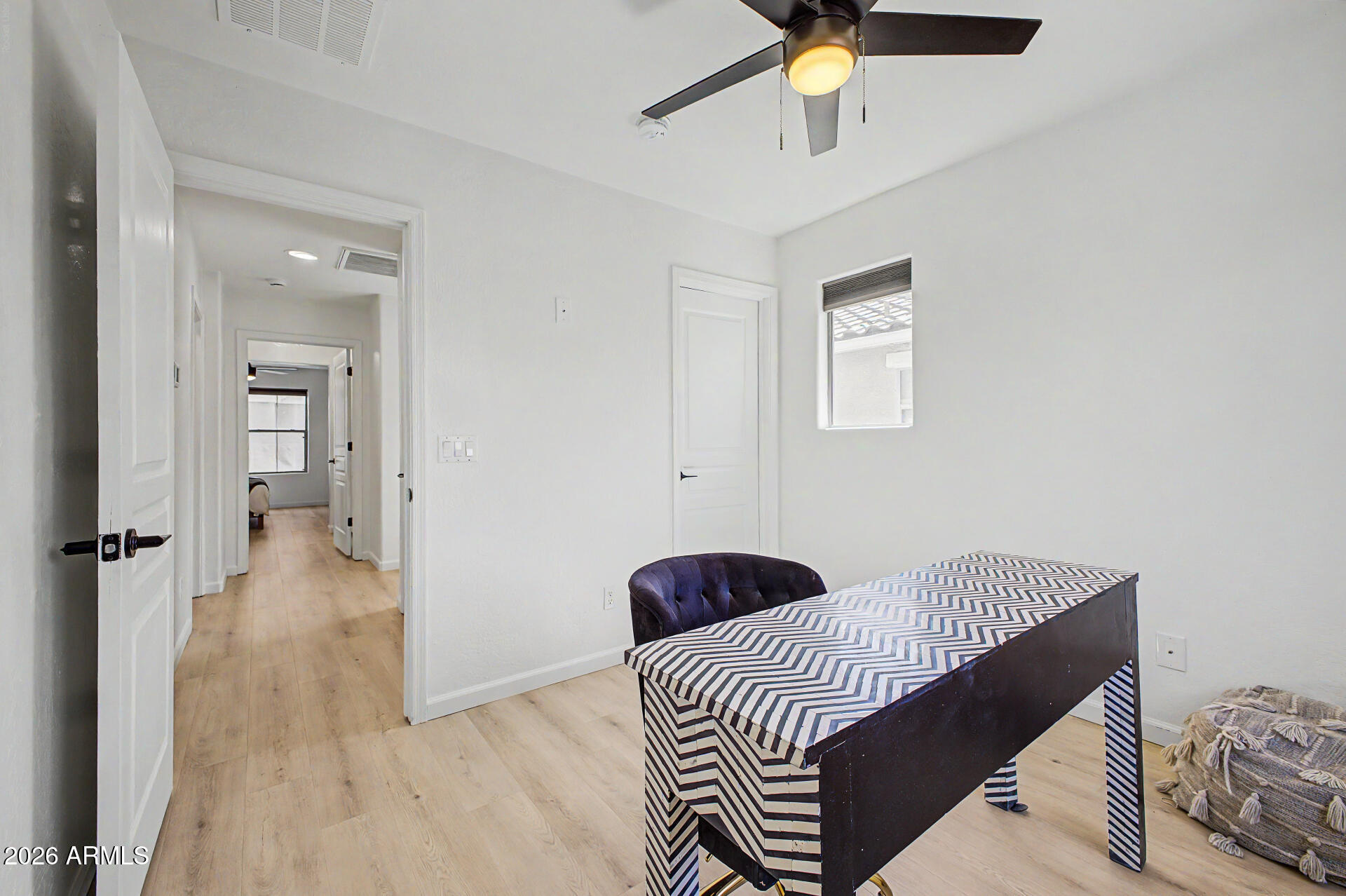 451 South Hawes Road, Unit 27 Mesa, AZ 85208 - Photo 23 of 27 a bedroom with a bed and wooden floor