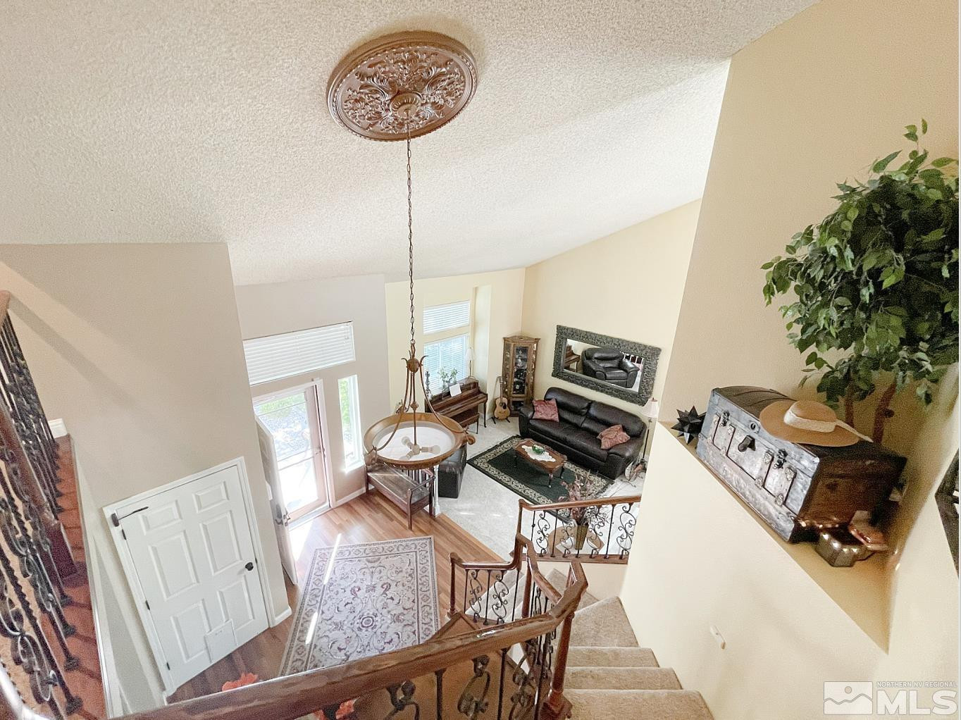 1677 Catherine Way Reno, NV 89523 - Photo 4 of 28 a view of a dining room with furniture wooden floor and a chandelier