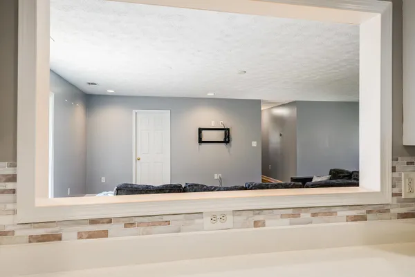 a kitchen with a sink stove and microwave