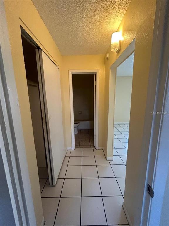1627 West Oak Ridge Road, Unit D Orlando, FL 32809 - Photo 10 of 17 a view of an empty room and wooden floor