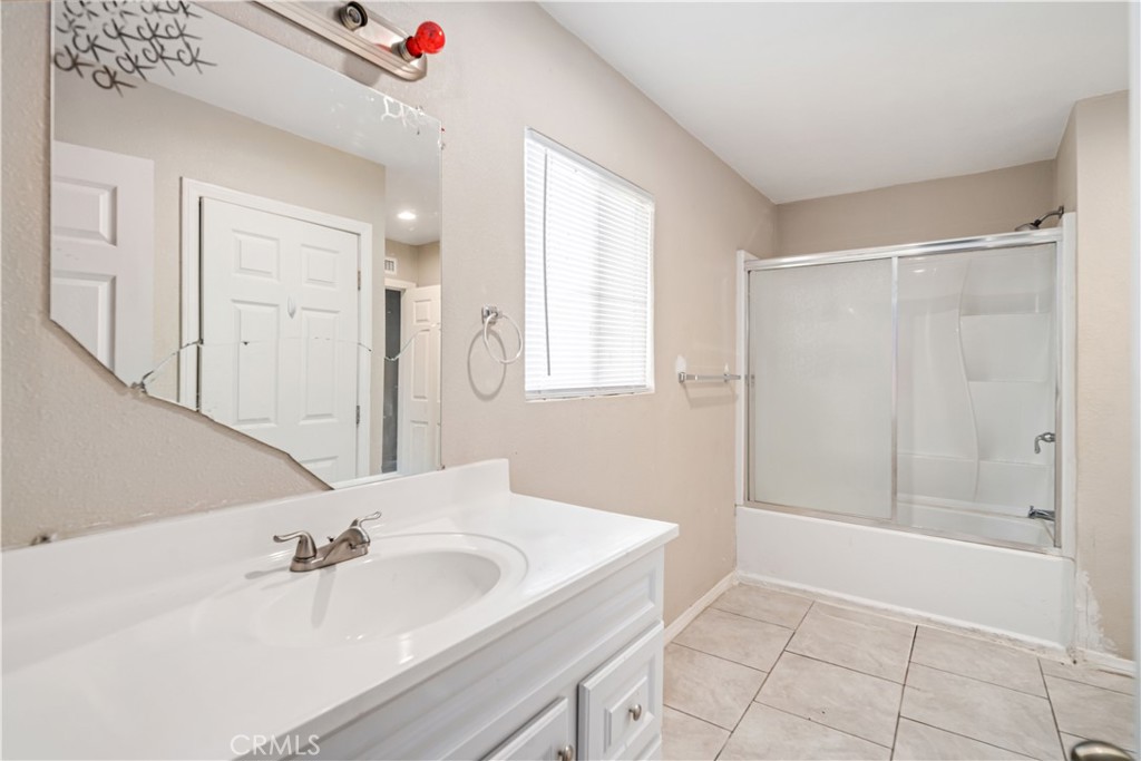 621 East Ave. J Lancaster, CA 93535 - Photo 17 of 25 a bathroom with a sink and a mirror
