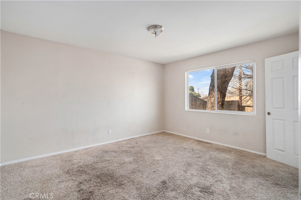 621 East Ave. J Lancaster, CA 93535 - Photo 19 of 25 an empty room with windows