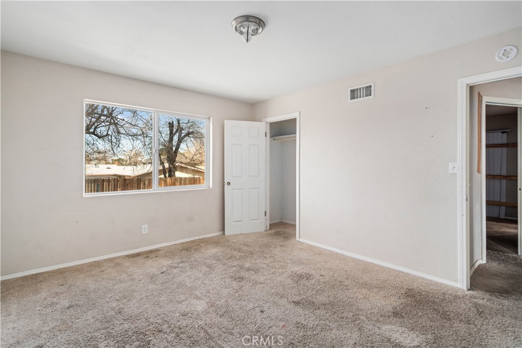 621 East Ave. J Lancaster, CA 93535 - Photo 20 of 25 an empty room with windows and closet