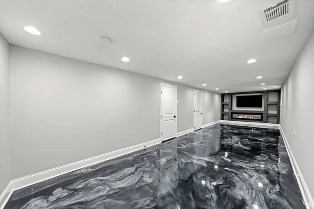 a view of a livingroom with wooden floor