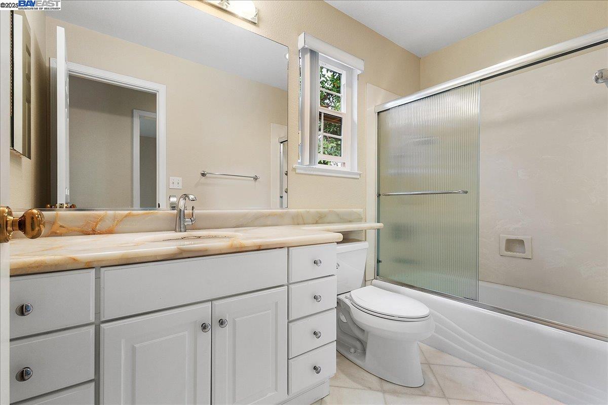 3 Cerruti Court Alameda, CA 94501 - Photo 18 of 22 a bathroom with a granite countertop sink toilet and shower