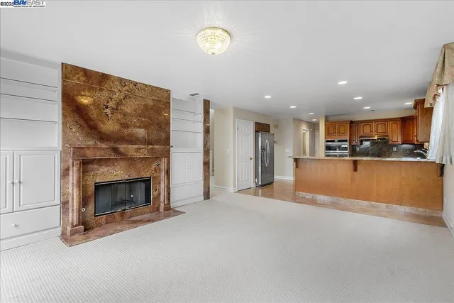 a view of kitchen and a fireplace