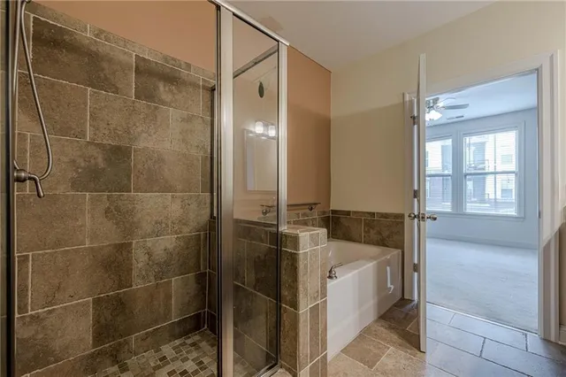a bathroom with a tub and shower