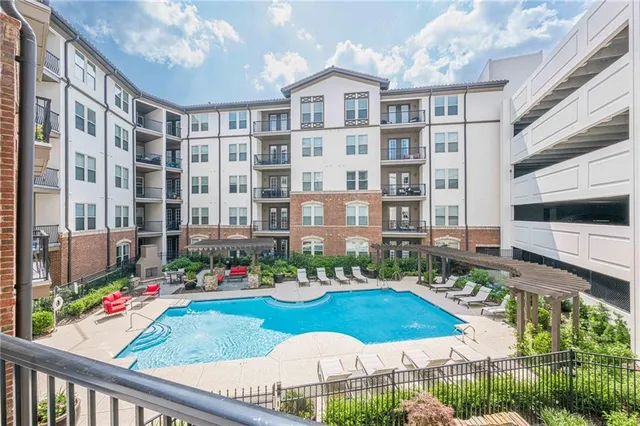 a view of a balcony with chairs