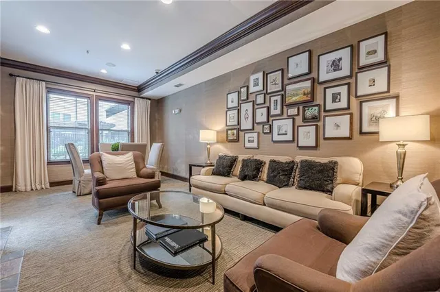 a living room with furniture a projector and a flat screen tv