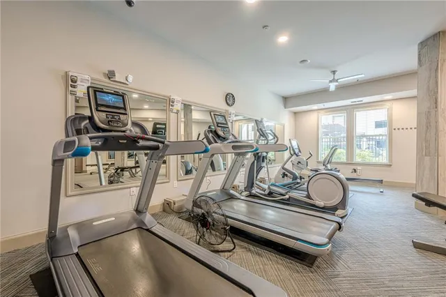 a view of a swimming pool with a bench and floor to ceiling window