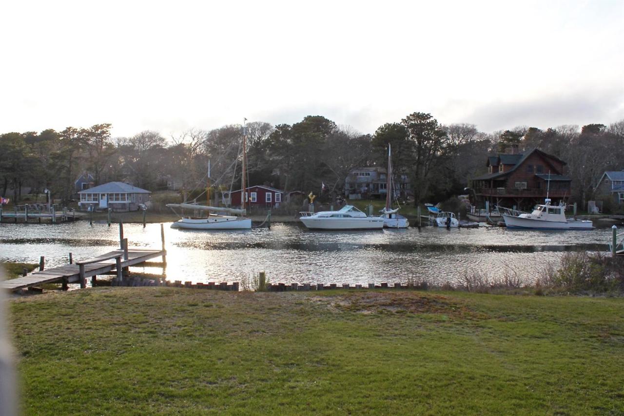 345 Monomoscoy Road Mashpee, MA 02649 - Photo 1 of 19 a view of a lake view with houses