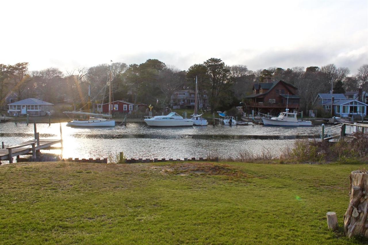 345 Monomoscoy Road Mashpee, MA 02649 - Photo 18 of 19 a view of a lake with houses