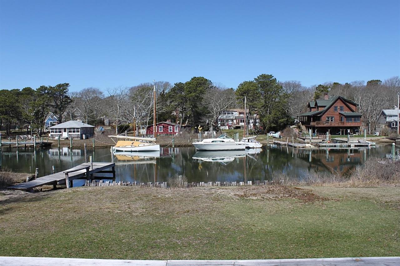 345 Monomoscoy Road Mashpee, MA 02649 - Photo 19 of 19 a view of a lake with houses
