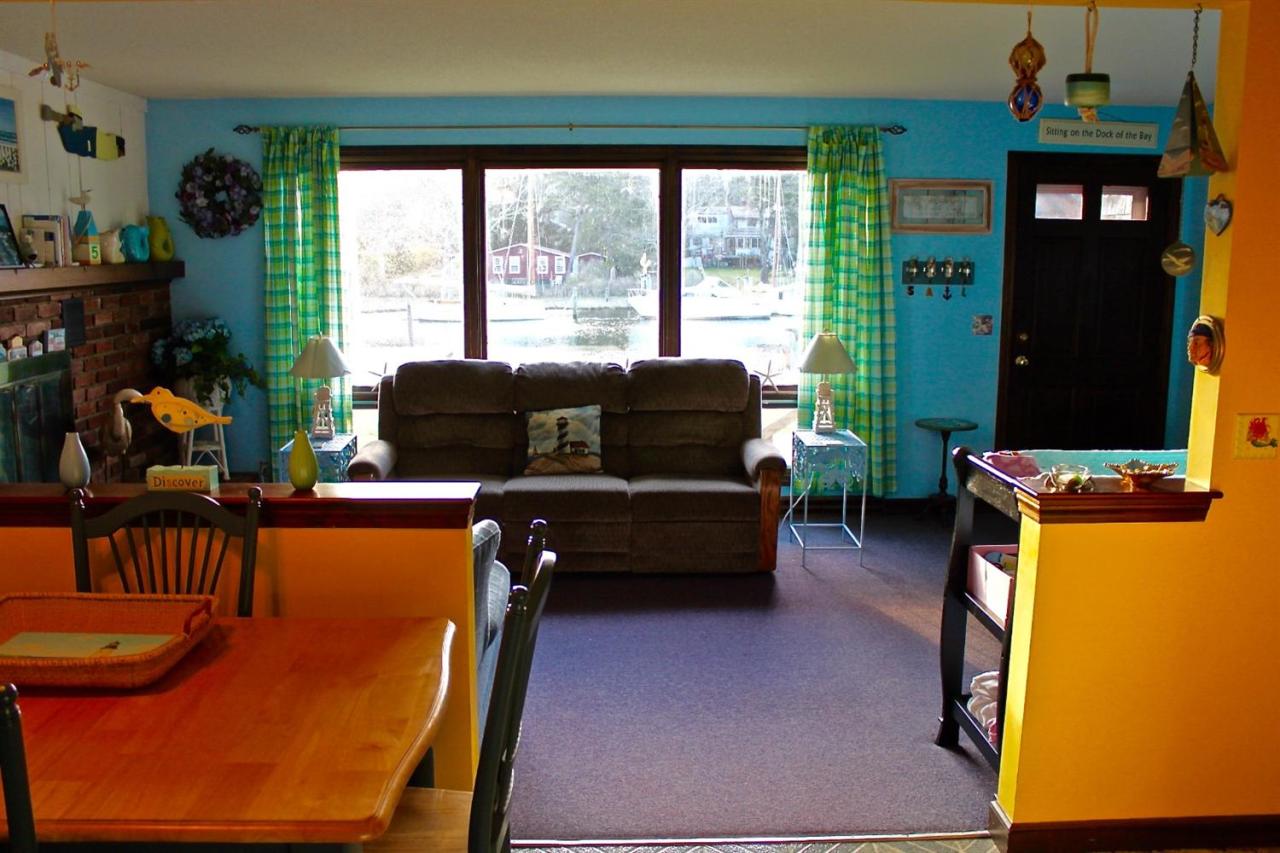 345 Monomoscoy Road Mashpee, MA 02649 - Photo 9 of 19 a living room with furniture and a window