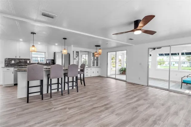 a view of a kitchen and dining room