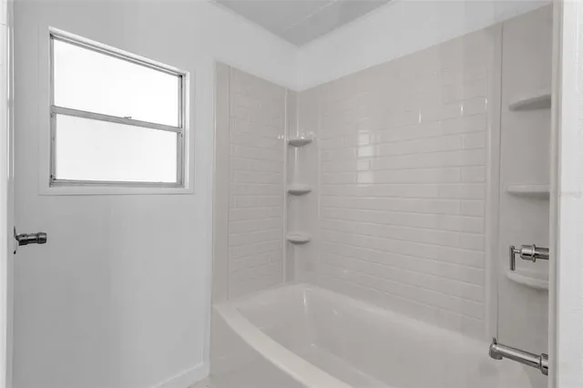 a close up of a bathtub curtain