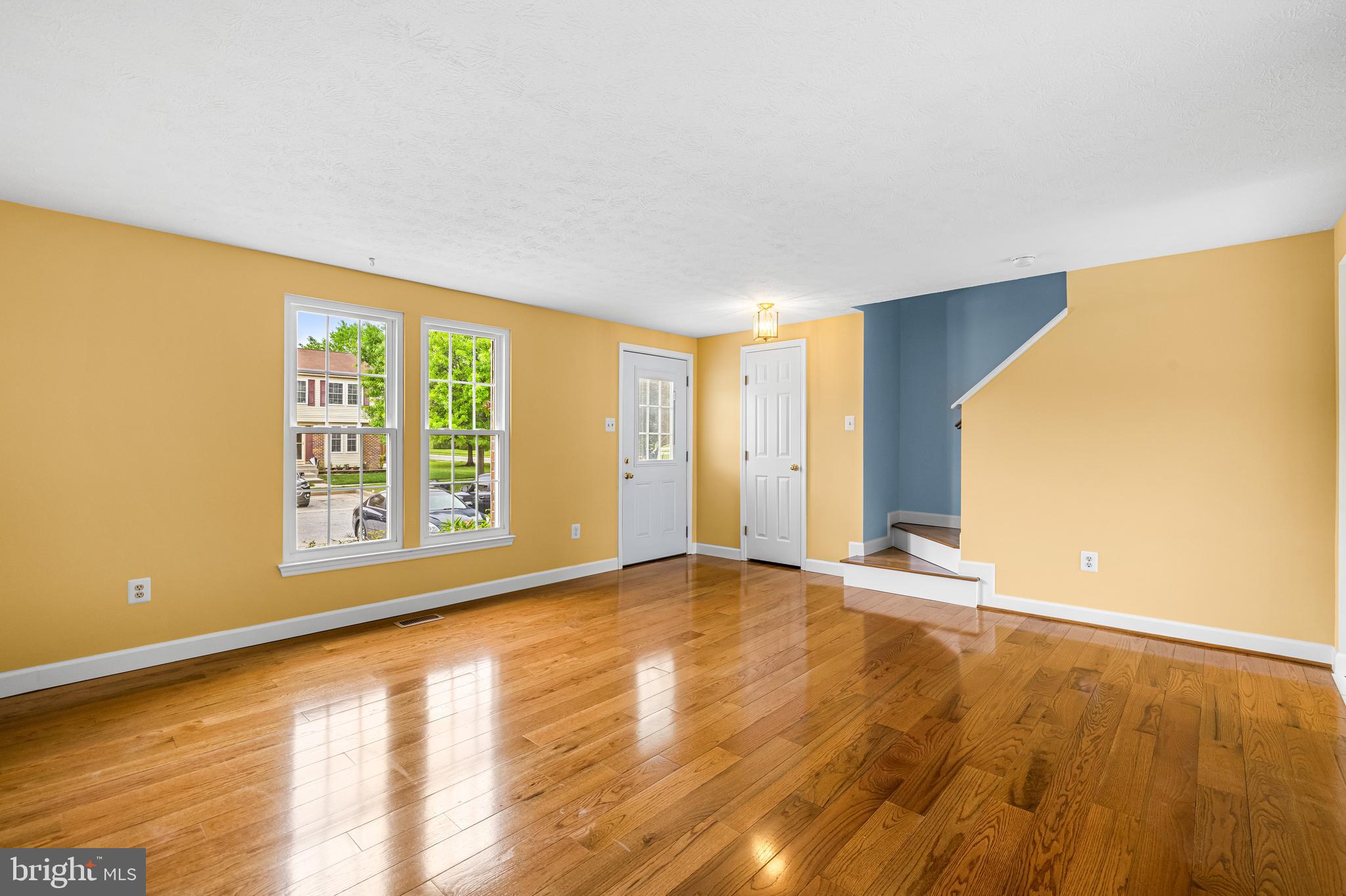 3790 Timahoe Circle Baltimore, MD 21236 - Photo 7 of 33 a view of an empty room with wooden floor and a window
