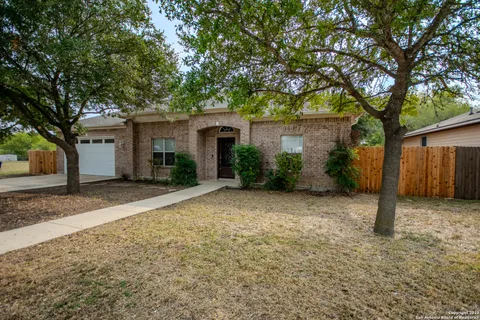 a view of a house with a yard and garage