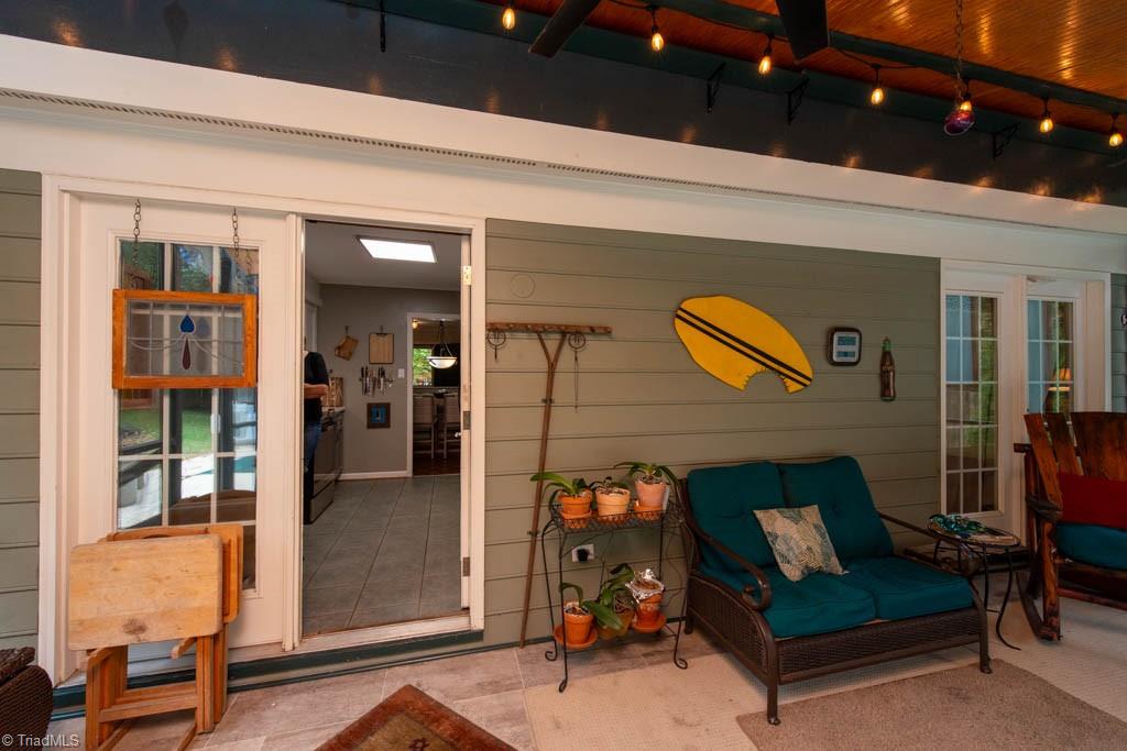 5107 Nantucket Road Greensboro, NC 27455 - Photo 7 of 50 Screened In Porch with view of pool
