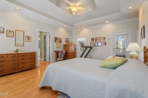 a bedroom with a bed and a bookshelf