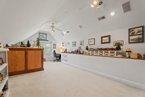 a bedroom with two beds and a table