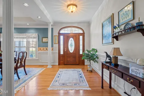 a view of a dining room and livingroom with furniture wooden floor and a view