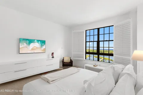 a spacious bathroom with a sink a large mirror and shower