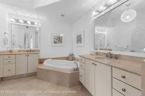 a living room with furniture a flat screen tv and a window