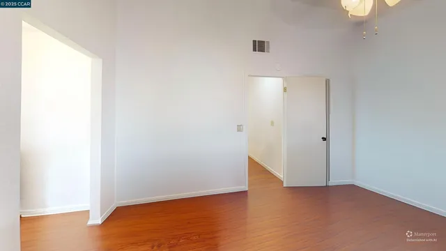 a bed room with a bed and a window