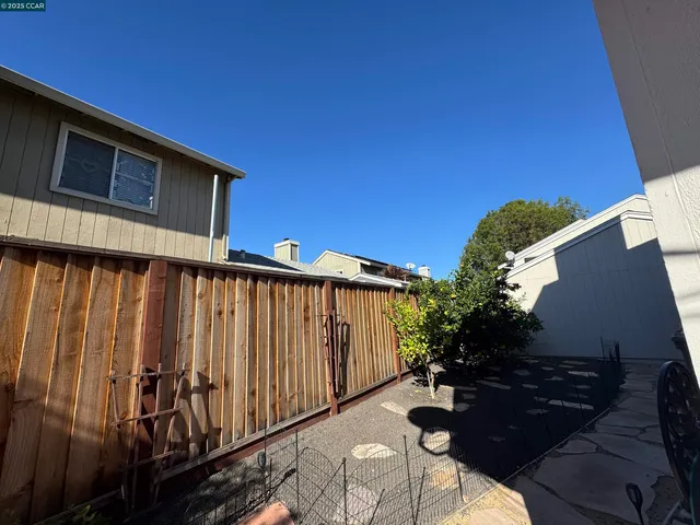 a view of a backyard with sitting area