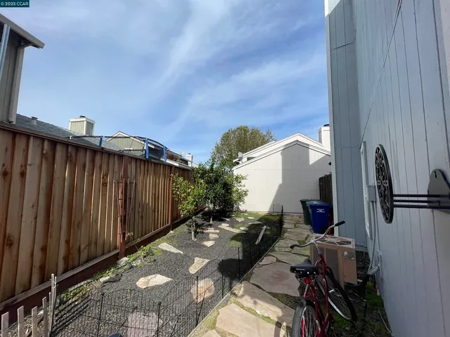 a view of a patio with table and chairs with wooden floor