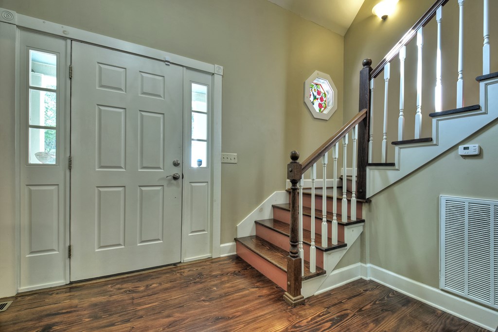 604 Ensley Road Epworth, GA 30541 - Photo 8 of 60 a view of entryway with wooden floor and stairs