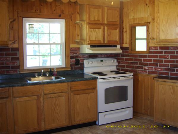 2012 Cross Street Three Rivers, MA 01080 - Photo 5 of 26 a kitchen with stainless steel appliances granite countertop a stove a sink and a microwave