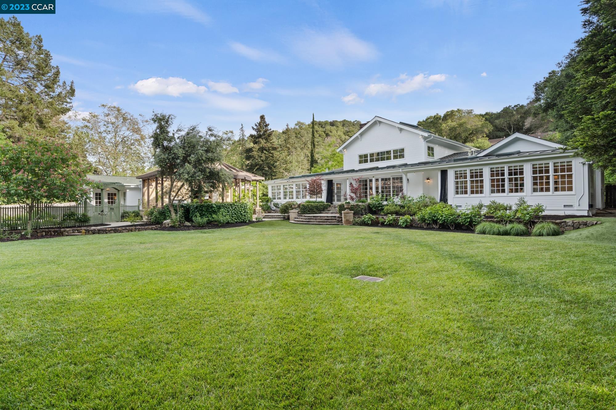 a view of a house with a big yard