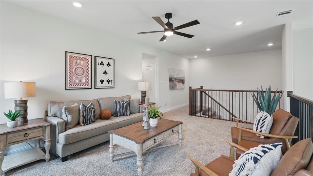 1016 Pitchfork Road Royse City, TX 75189 - Photo 32 of 35 a living room with furniture and a wooden floor