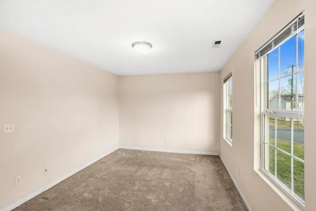 a view of a big room with windows