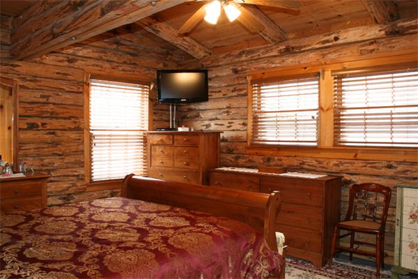 115 Secret Lake Road Phillipston, MA 01331 - Photo 13 of 20 a bedroom with a bed and a flat screen tv