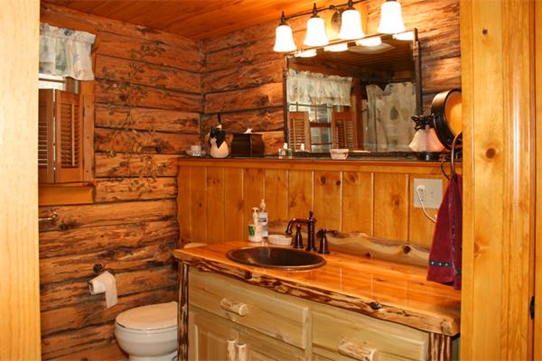 115 Secret Lake Road Phillipston, MA 01331 - Photo 15 of 20 a bathroom with a granite countertop sink toilet and mirror