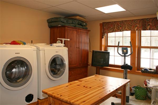 115 Secret Lake Road Phillipston, MA 01331 - Photo 16 of 20 a room with a bed and a large window with the outer view