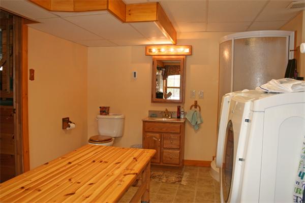 115 Secret Lake Road Phillipston, MA 01331 - Photo 17 of 20 a bedroom with a bed and wooden floor