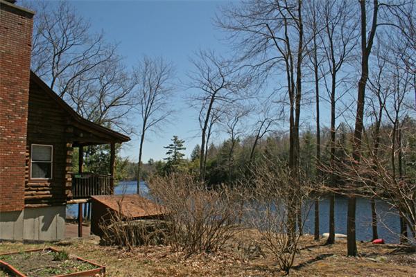 115 Secret Lake Road Phillipston, MA 01331 - Photo 20 of 20 a view of a chairs and table in backyard