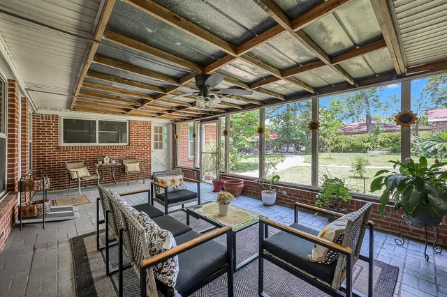 a view of a room with furniture and a potted plant