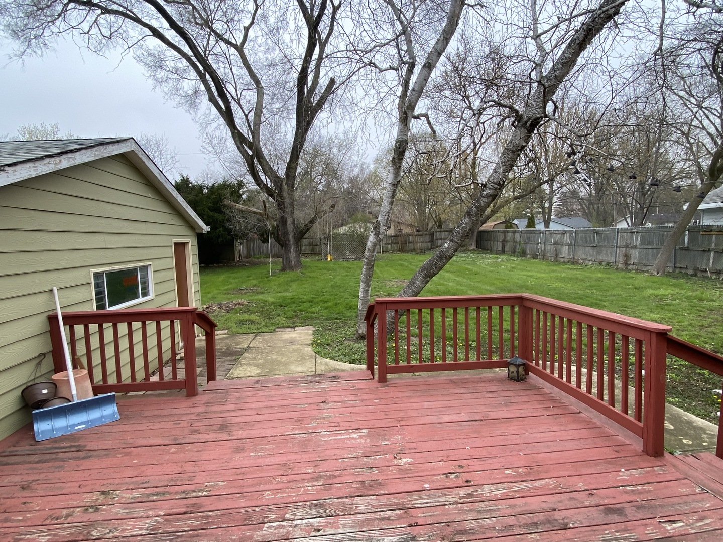 329 Douglas Road Batavia, IL 60510 - Photo 16 of 23 a view of a deck with couches and wooden floor and fence next to a yard