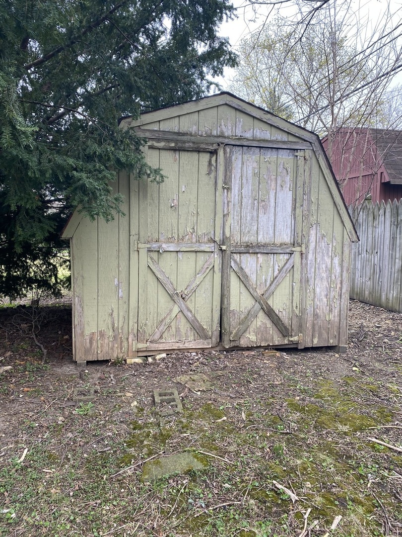 329 Douglas Road Batavia, IL 60510 - Photo 19 of 23 a wooden house with trees in front of it