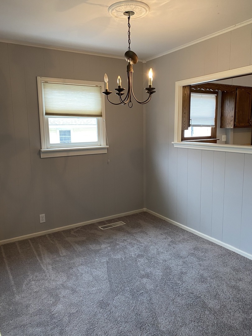329 Douglas Road Batavia, IL 60510 - Photo 4 of 23 a view of an empty room with a window