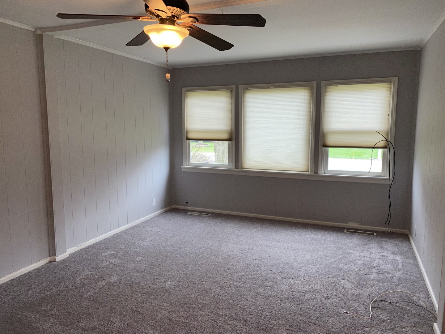 329 Douglas Road Batavia, IL 60510 - Photo 5 of 23 a view of an empty room with window and chandelier fan