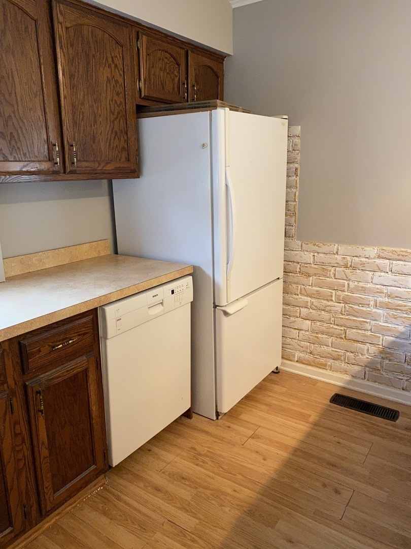 329 Douglas Road Batavia, IL 60510 - Photo 7 of 23 a utility room with wooden floor washer and dryer