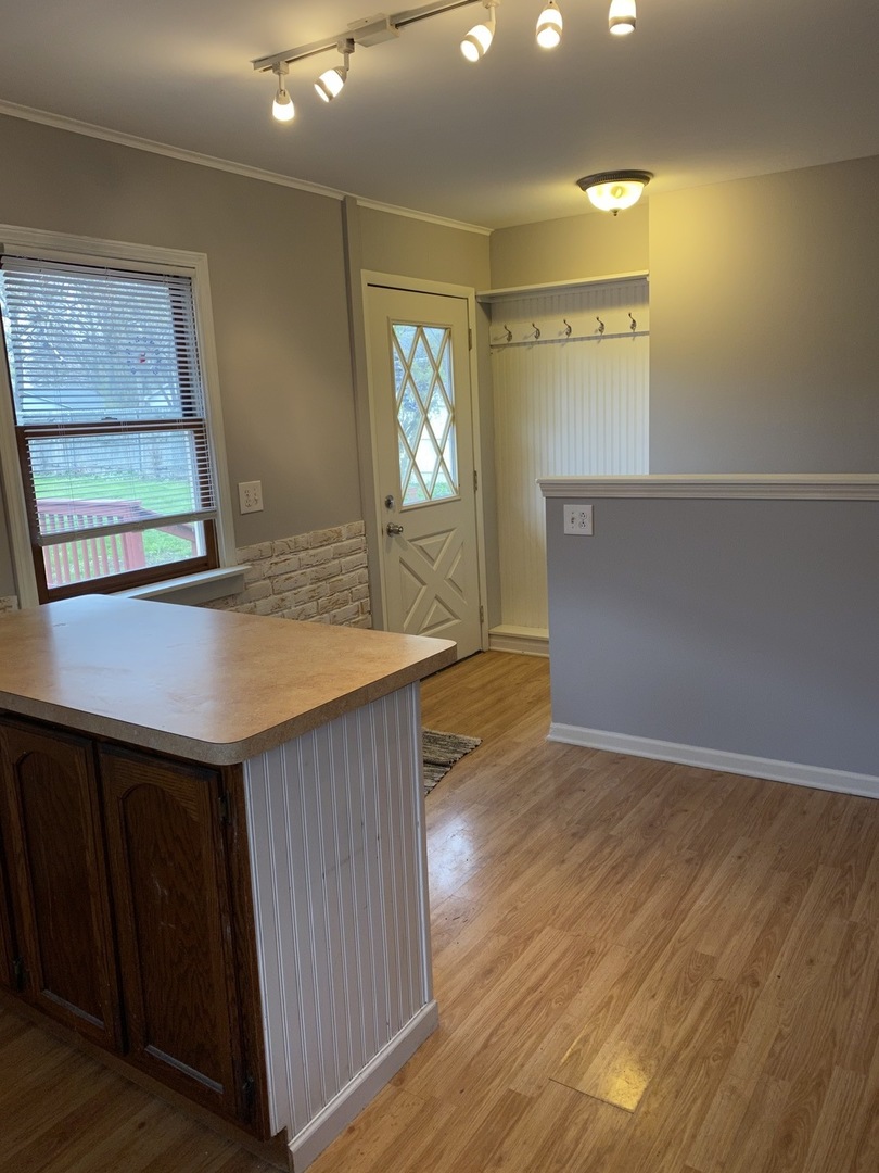 329 Douglas Road Batavia, IL 60510 - Photo 9 of 23 a kitchen with granite countertop a sink and a wooden floor