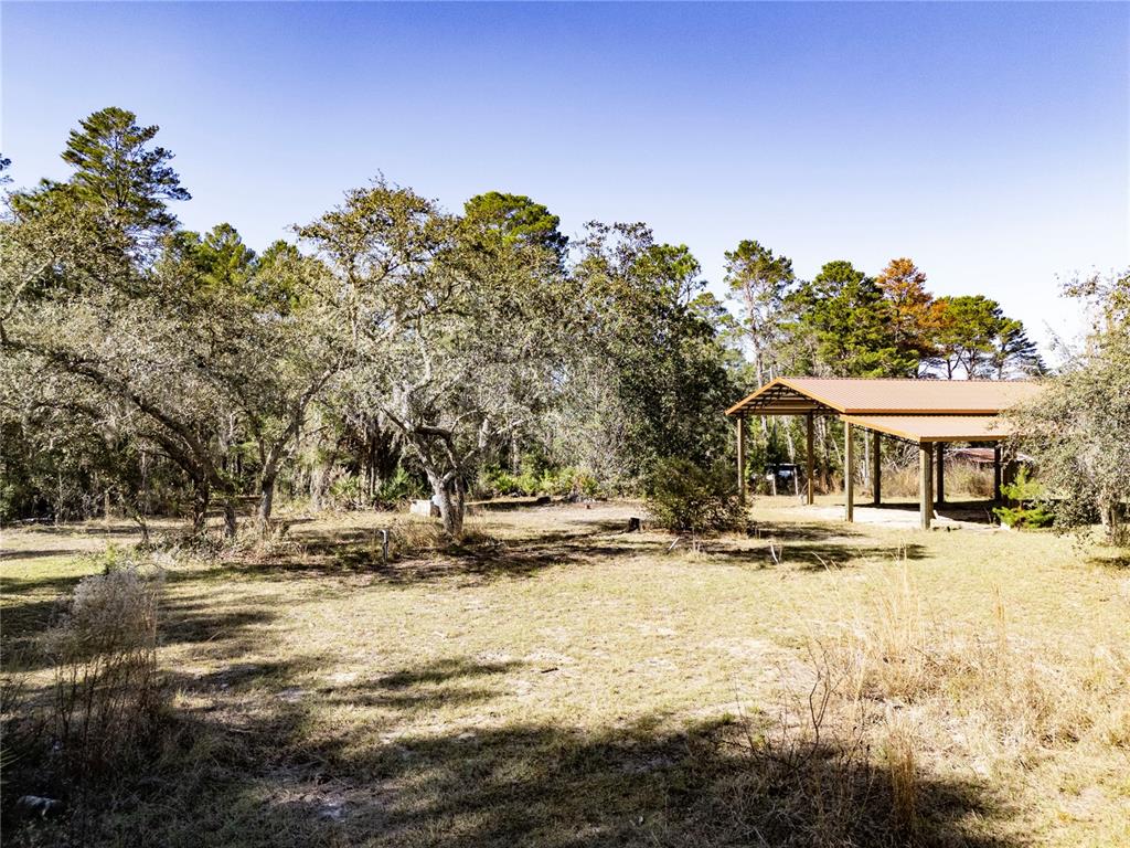 a view of a house with a snow on the road