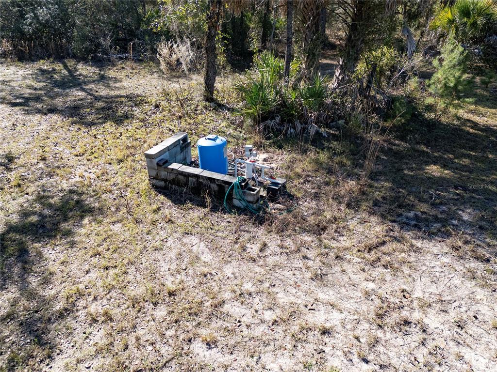 18129 Southwest 200th Street Archer, FL 32618 - Photo 11 of 24 a view of a backyard with wooden fence